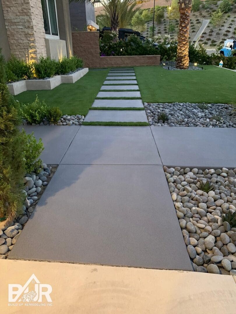 Concrete outdoor living surface completed by Build Up Remodeling