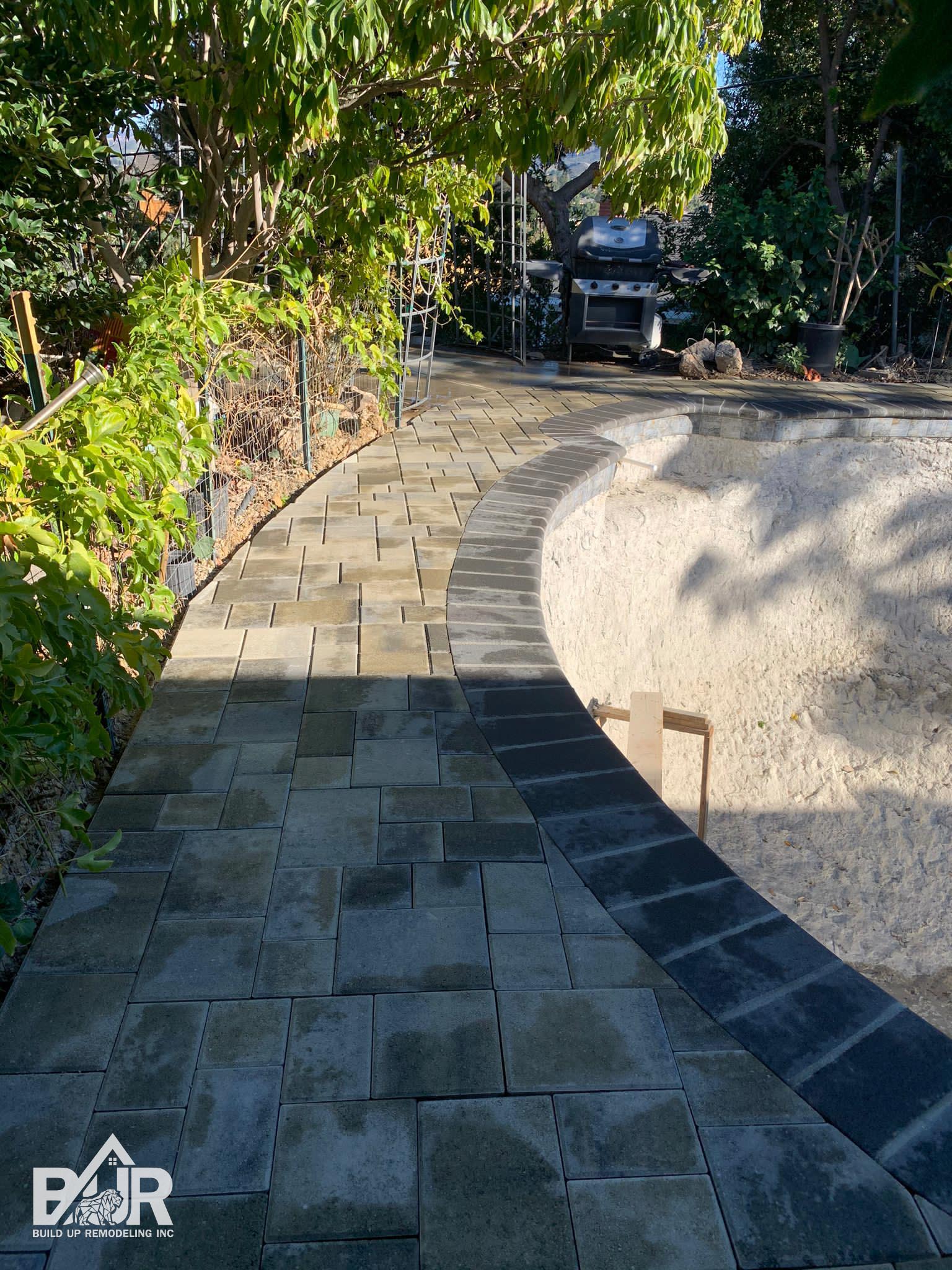 New pavers around remodeled swimming pool Simi Valley
