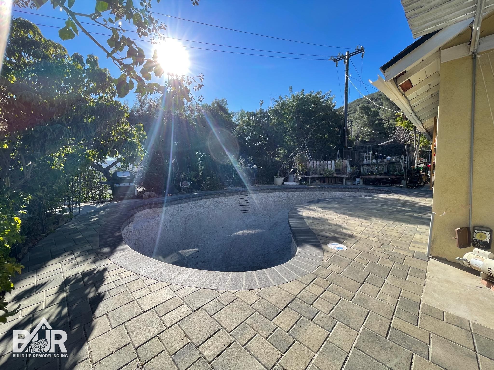Courtyard paver installation around Simi Valley pool