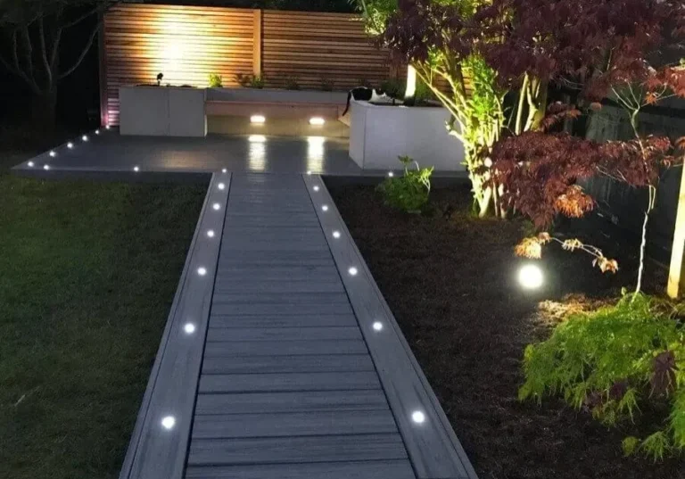 Modern garden path with illuminated decking.