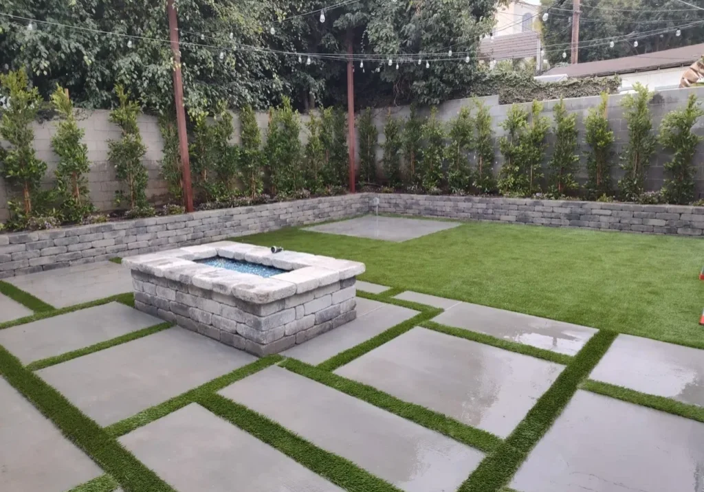 Modern backyard with stone fire pit.